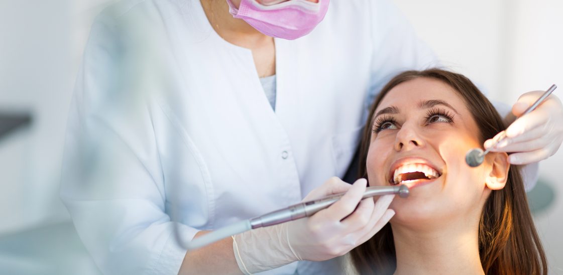 woman being examined by a dentist