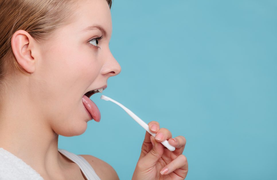 Should you scrape your tongue before or after brushing?